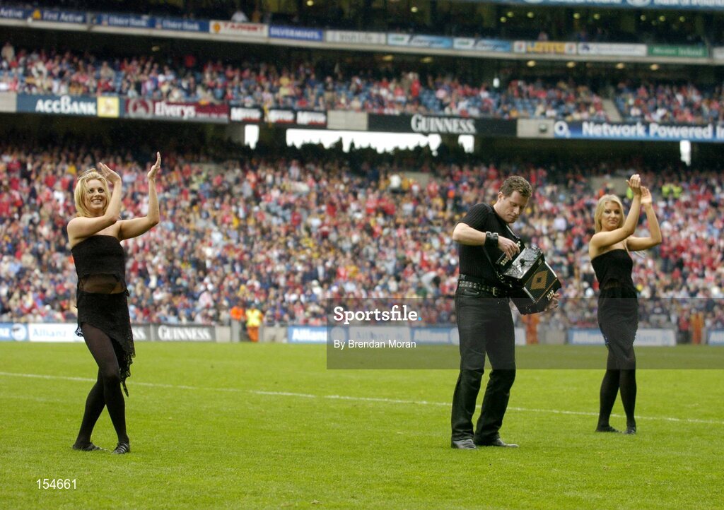 12 September 2004; Musician Liam O'Connor and dancers entertain the crowd at half-time. Guinness All-Ireland Senior Hurling Championship Final, Cork v Kilkenny, Croke Park, Dublin. Picture credit; Brendan Moran / SPORTSFILE *** Local Caption *** Any photograph taken by SPORTSFILE during, or in connection with, the 2004 Guinness All-Ireland Hurling Final which displays GAA logos or contains an image or part of an image of any GAA intellectual property, or, which contains images of a GAA player/players in their playing uniforms, may only be used for editorial and non-advertising purposes.  Use of photographs for advertising, as posters or for purchase separately is strictly prohibited unless prior written approval has been obtained from the Gaelic Athletic Association.