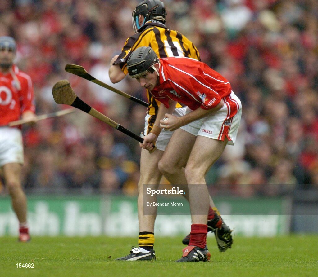 12 September 2004; John Gardiner, Cork, in action against John Hoyne, Kilkenny. Guinness All-Ireland Senior Hurling Championship Final, Cork v Kilkenny, Croke Park, Dublin. Picture credit; Brendan Moran / SPORTSFILE *** Local Caption *** Any photograph taken by SPORTSFILE during, or in connection with, the 2004 Guinness All-Ireland Hurling Final which displays GAA logos or contains an image or part of an image of any GAA intellectual property, or, which contains images of a GAA player/players in their playing uniforms, may only be used for editorial and non-advertising purposes.  Use of photographs for advertising, as posters or for purchase separately is strictly prohibited unless prior written approval has been obtained from the Gaelic Athletic Association.