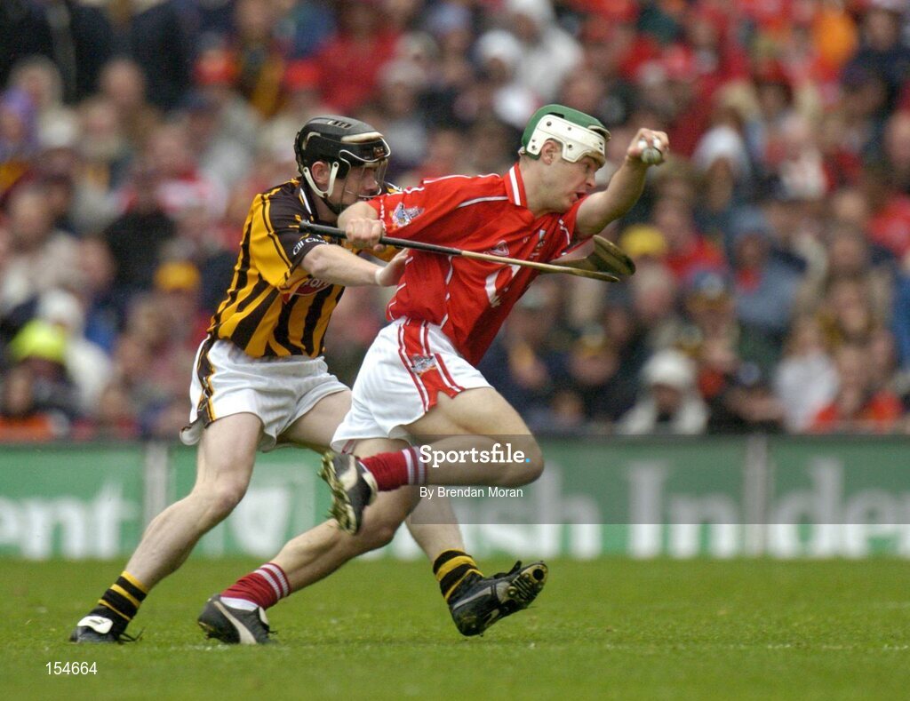 12 September 2004; Niall McCarthy, Cork, in action against Peter Barry, Kilkenny. Guinness All-Ireland Senior Hurling Championship Final, Cork v Kilkenny, Croke Park, Dublin. Picture credit; Brendan Moran / SPORTSFILE *** Local Caption *** Any photograph taken by SPORTSFILE during, or in connection with, the 2004 Guinness All-Ireland Hurling Final which displays GAA logos or contains an image or part of an image of any GAA intellectual property, or, which contains images of a GAA player/players in their playing uniforms, may only be used for editorial and non-advertising purposes.  Use of photographs for advertising, as posters or for purchase separately is strictly prohibited unless prior written approval has been obtained from the Gaelic Athletic Association.