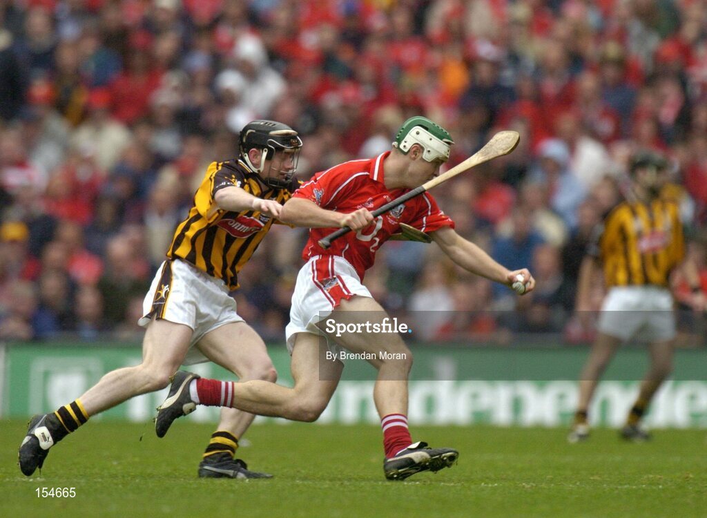 12 September 2004; Niall McCarthy, Cork, in action against Peter Barry, Kilkenny. Guinness All-Ireland Senior Hurling Championship Final, Cork v Kilkenny, Croke Park, Dublin. Picture credit; Brendan Moran / SPORTSFILE *** Local Caption *** Any photograph taken by SPORTSFILE during, or in connection with, the 2004 Guinness All-Ireland Hurling Final which displays GAA logos or contains an image or part of an image of any GAA intellectual property, or, which contains images of a GAA player/players in their playing uniforms, may only be used for editorial and non-advertising purposes.  Use of photographs for advertising, as posters or for purchase separately is strictly prohibited unless prior written approval has been obtained from the Gaelic Athletic Association.