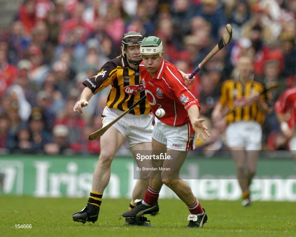 12 September 2004; Niall McCarthy, Cork, in action against Peter Barry, Kilkenny. Guinness All-Ireland Senior Hurling Championship Final, Cork v Kilkenny, Croke Park, Dublin. Picture credit; Brendan Moran / SPORTSFILE *** Local Caption *** Any photograph taken by SPORTSFILE during, or in connection with, the 2004 Guinness All-Ireland Hurling Final which displays GAA logos or contains an image or part of an image of any GAA intellectual property, or, which contains images of a GAA player/players in their playing uniforms, may only be used for editorial and non-advertising purposes.  Use of photographs for advertising, as posters or for purchase separately is strictly prohibited unless prior written approval has been obtained from the Gaelic Athletic Association.