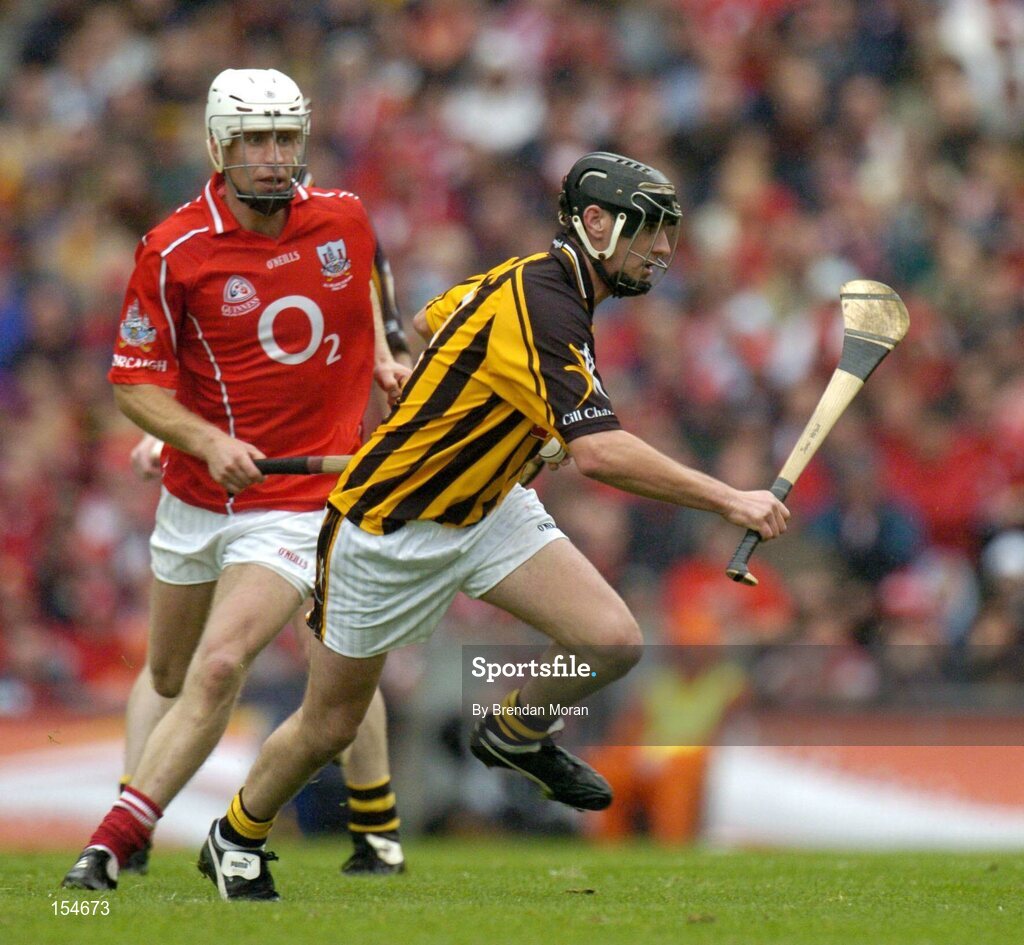 12 September 2004; Ken Coogan, Kilkenny, in action against Timmy McCarthy, Cork. Guinness All-Ireland Senior Hurling Championship Final, Cork v Kilkenny, Croke Park, Dublin. Picture credit; Brendan Moran / SPORTSFILE *** Local Caption *** Any photograph taken by SPORTSFILE during, or in connection with, the 2004 Guinness All-Ireland Hurling Final which displays GAA logos or contains an image or part of an image of any GAA intellectual property, or, which contains images of a GAA player/players in their playing uniforms, may only be used for editorial and non-advertising purposes.  Use of photographs for advertising, as posters or for purchase separately is strictly prohibited unless prior written approval has been obtained from the Gaelic Athletic Association.