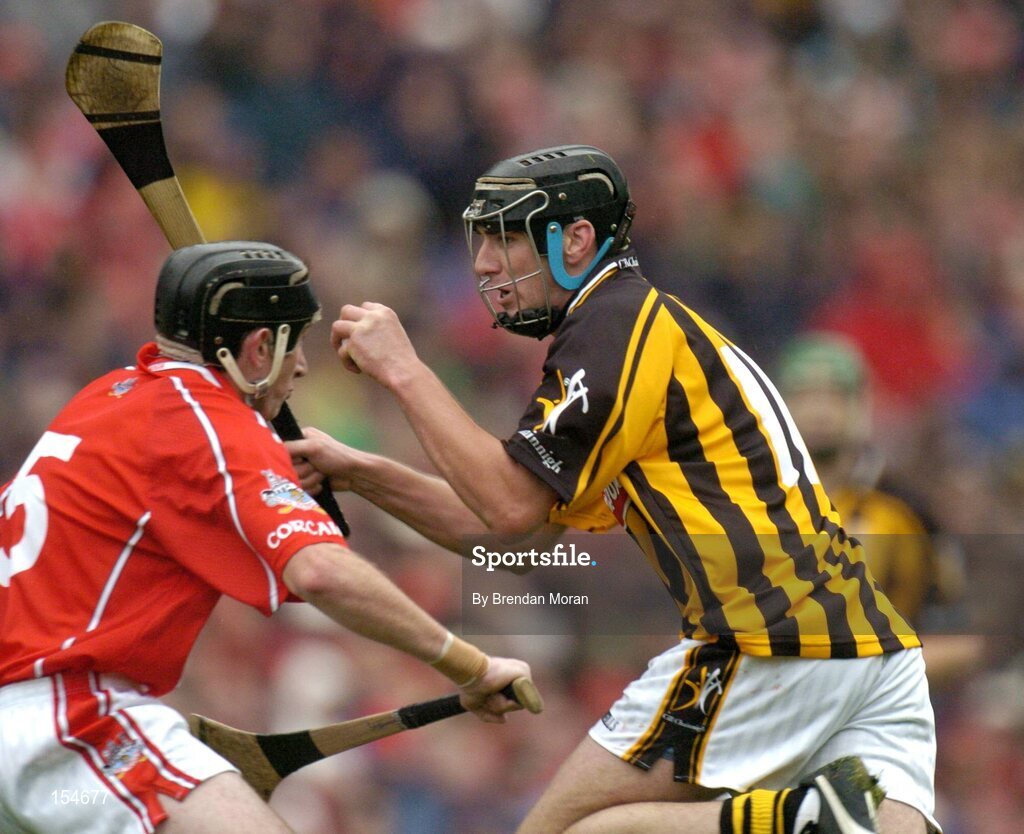 12 September 2004; John Hoyne, Kilkenny, in action against John Gardiner, Cork. Guinness All-Ireland Senior Hurling Championship Final, Cork v Kilkenny, Croke Park, Dublin. Picture credit; Brendan Moran / SPORTSFILE *** Local Caption *** Any photograph taken by SPORTSFILE during, or in connection with, the 2004 Guinness All-Ireland Hurling Final which displays GAA logos or contains an image or part of an image of any GAA intellectual property, or, which contains images of a GAA player/players in their playing uniforms, may only be used for editorial and non-advertising purposes.  Use of photographs for advertising, as posters or for purchase separately is strictly prohibited unless prior written approval has been obtained from the Gaelic Athletic Association.
