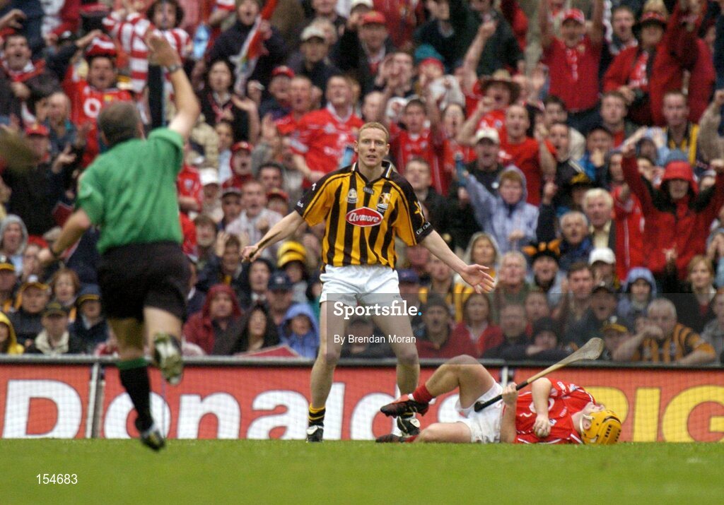 12 September 2004; Referee Oadan MacSuibhne whistles for a free after Kilkenny's James Ryall fouled Cork's Joe Deane. Guinness All-Ireland Senior Hurling Championship Final, Cork v Kilkenny, Croke Park, Dublin. Picture credit; Brendan Moran / SPORTSFILE *** Local Caption *** Any photograph taken by SPORTSFILE during, or in connection with, the 2004 Guinness All-Ireland Hurling Final which displays GAA logos or contains an image or part of an image of any GAA intellectual property, or, which contains images of a GAA player/players in their playing uniforms, may only be used for editorial and non-advertising purposes.  Use of photographs for advertising, as posters or for purchase separately is strictly prohibited unless prior written approval has been obtained from the Gaelic Athletic Association.