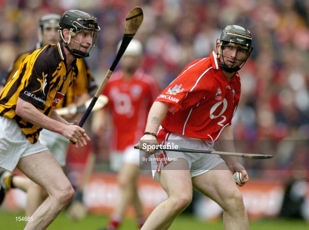 12 September 2004; Wayne Sherlock, Cork, in action against Martin Comerford, Kilkenny. Guinness All-Ireland Senior Hurling Championship Final, Cork v Kilkenny, Croke Park, Dublin. Picture credit; Brendan Moran / SPORTSFILE *** Local Caption *** Any photograph taken by SPORTSFILE during, or in connection with, the 2004 Guinness All-Ireland Hurling Final which displays GAA logos or contains an image or part of an image of any GAA intellectual property, or, which contains images of a GAA player/players in their playing uniforms, may only be used for editorial and non-advertising purposes.  Use of photographs for advertising, as posters or for purchase separately is strictly prohibited unless prior written approval has been obtained from the Gaelic Athletic Association.