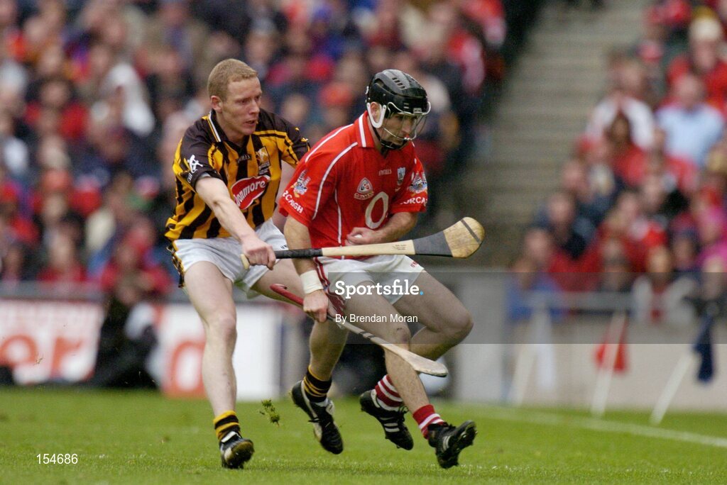 12 September 2004; Ben O'Connor, Cork, in action against James Ryall, Kilkenny. Guinness All-Ireland Senior Hurling Championship Final, Cork v Kilkenny, Croke Park, Dublin. Picture credit; Brendan Moran / SPORTSFILE *** Local Caption *** Any photograph taken by SPORTSFILE during, or in connection with, the 2004 Guinness All-Ireland Hurling Final which displays GAA logos or contains an image or part of an image of any GAA intellectual property, or, which contains images of a GAA player/players in their playing uniforms, may only be used for editorial and non-advertising purposes.  Use of photographs for advertising, as posters or for purchase separately is strictly prohibited unless prior written approval has been obtained from the Gaelic Athletic Association.