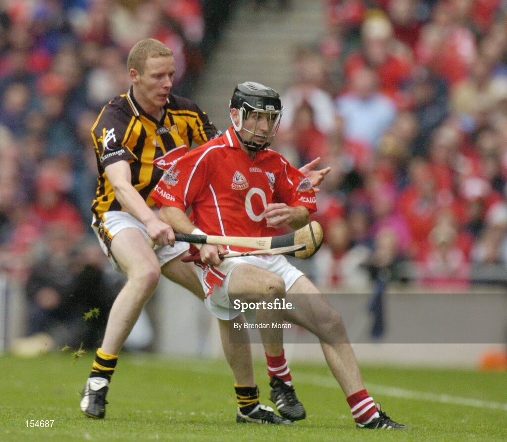 12 September 2004; Ben O'Connor, Cork, in action against James Ryall, Kilkenny. Guinness All-Ireland Senior Hurling Championship Final, Cork v Kilkenny, Croke Park, Dublin. Picture credit; Brendan Moran / SPORTSFILE *** Local Caption *** Any photograph taken by SPORTSFILE during, or in connection with, the 2004 Guinness All-Ireland Hurling Final which displays GAA logos or contains an image or part of an image of any GAA intellectual property, or, which contains images of a GAA player/players in their playing uniforms, may only be used for editorial and non-advertising purposes.  Use of photographs for advertising, as posters or for purchase separately is strictly prohibited unless prior written approval has been obtained from the Gaelic Athletic Association.
