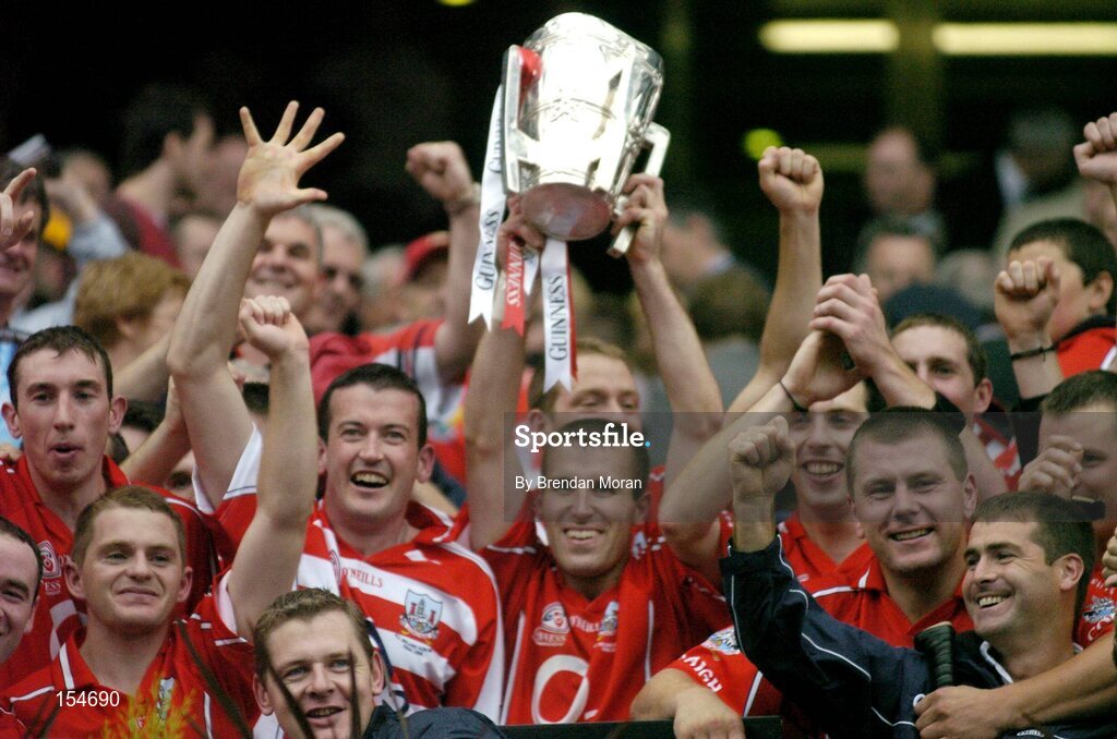 12 September 2004; Cork captain Ben O'Connor and team-mates celebrate with the Liam MacCarthy cup after victory over Kilkenny. Guinness All-Ireland Senior Hurling Championship Final, Cork v Kilkenny, Croke Park, Dublin. Picture credit; Brendan Moran / SPORTSFILE *** Local Caption *** Any photograph taken by SPORTSFILE during, or in connection with, the 2004 Guinness All-Ireland Hurling Final which displays GAA logos or contains an image or part of an image of any GAA intellectual property, or, which contains images of a GAA player/players in their playing uniforms, may only be used for editorial and non-advertising purposes.  Use of photographs for advertising, as posters or for purchase separately is strictly prohibited unless prior written approval has been obtained from the Gaelic Athletic Association.
