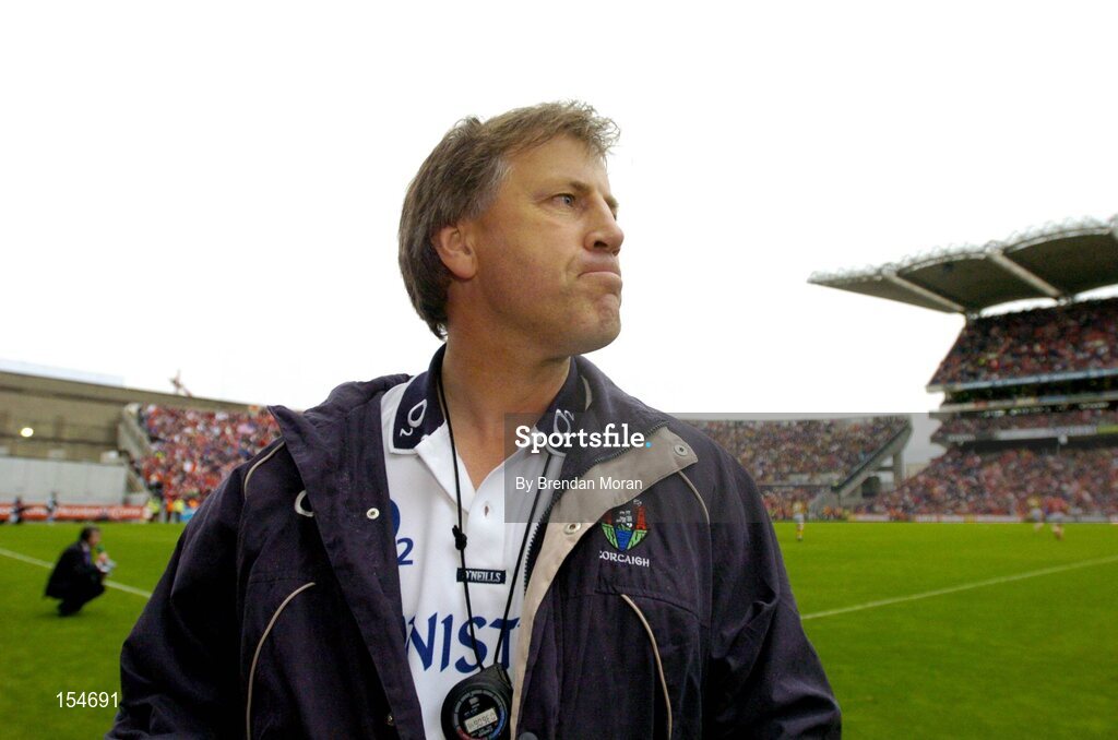 12 September 2004; Cork manager Donal O'Grady watches the final moments of the game. Guinness All-Ireland Senior Hurling Championship Final, Cork v Kilkenny, Croke Park, Dublin. Picture credit; Brendan Moran / SPORTSFILE *** Local Caption *** Any photograph taken by SPORTSFILE during, or in connection with, the 2004 Guinness All-Ireland Hurling Final which displays GAA logos or contains an image or part of an image of any GAA intellectual property, or, which contains images of a GAA player/players in their playing uniforms, may only be used for editorial and non-advertising purposes.  Use of photographs for advertising, as posters or for purchase separately is strictly prohibited unless prior written approval has been obtained from the Gaelic Athletic Association.