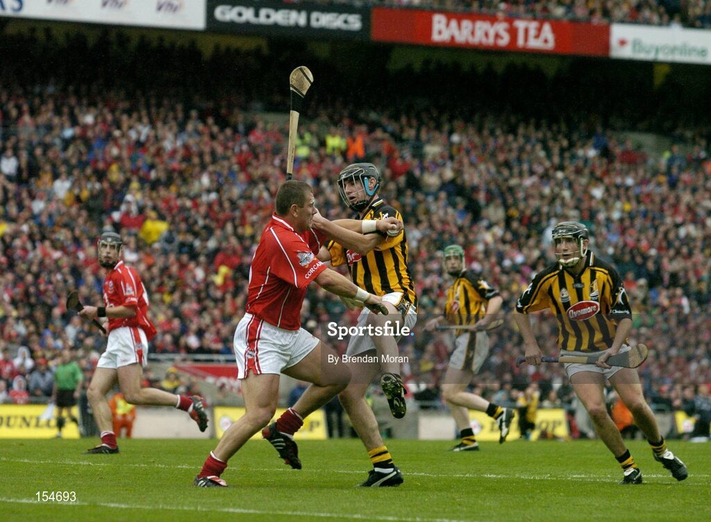 12 September 2004; Diarmuid O'Sullivan, Cork, in action against John Hoyne, Kilkenny. Guinness All-Ireland Senior Hurling Championship Final, Cork v Kilkenny, Croke Park, Dublin. Picture credit; Brendan Moran / SPORTSFILE *** Local Caption *** Any photograph taken by SPORTSFILE during, or in connection with, the 2004 Guinness All-Ireland Hurling Final which displays GAA logos or contains an image or part of an image of any GAA intellectual property, or, which contains images of a GAA player/players in their playing uniforms, may only be used for editorial and non-advertising purposes.  Use of photographs for advertising, as posters or for purchase separately is strictly prohibited unless prior written approval has been obtained from the Gaelic Athletic Association.