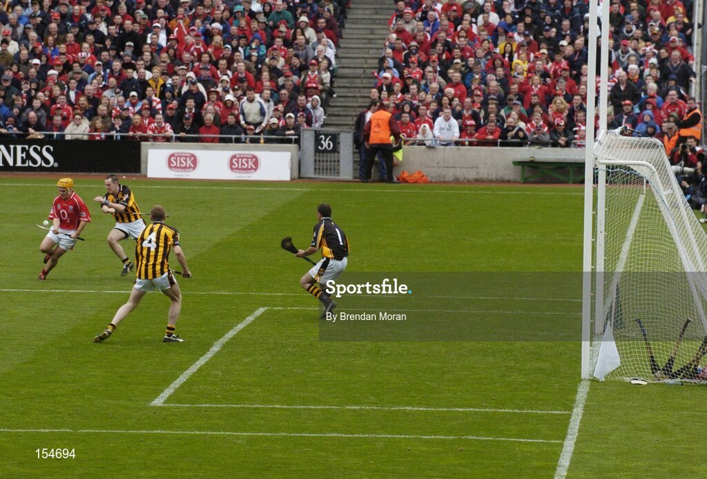 12 September 2004; Joe Deane, Cork, in action against Michael Kavanagh, James Ryall (4) and goalkeeper James McGarry, Kilkenny. Guinness All-Ireland Senior Hurling Championship Final, Cork v Kilkenny, Croke Park, Dublin. Picture credit; Brendan Moran / SPORTSFILE *** Local Caption *** Any photograph taken by SPORTSFILE during, or in connection with, the 2004 Guinness All-Ireland Hurling Final which displays GAA logos or contains an image or part of an image of any GAA intellectual property, or, which contains images of a GAA player/players in their playing uniforms, may only be used for editorial and non-advertising purposes.  Use of photographs for advertising, as posters or for purchase separately is strictly prohibited unless prior written approval has been obtained from the Gaelic Athletic Association.