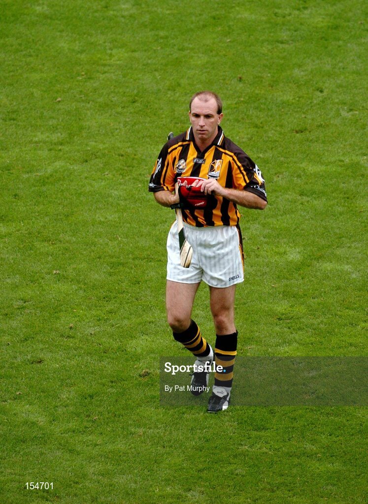 12 September 2004; DJ Carey, Kilkenny, makes his way over for the team parade. Guinness All-Ireland Senior Hurling Championship Final, Cork v Kilkenny, Croke Park, Dublin. Picture credit; Pat Murphy / SPORTSFILE *** Local Caption *** Any photograph taken by SPORTSFILE during, or in connection with, the 2004 Guinness All-Ireland Hurling Final which displays GAA logos or contains an image or part of an image of any GAA intellectual property, or, which contains images of a GAA player/players in their playing uniforms, may only be used for editorial and non-advertising purposes.  Use of photographs for advertising, as posters or for purchase separately is strictly prohibited unless prior written approval has been obtained from the Gaelic Athletic Association.