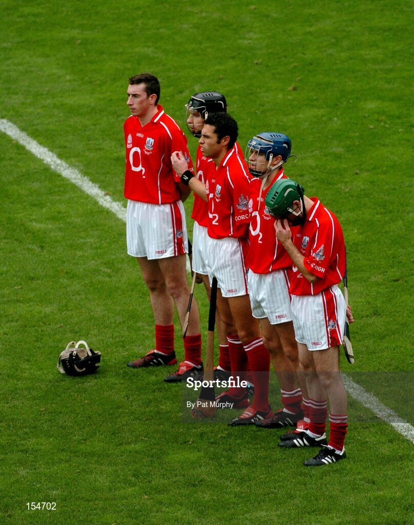 12 September 2004; Cork players stand for a minutes silence. Guinness All-Ireland Senior Hurling Championship Final, Cork v Kilkenny, Croke Park, Dublin. Picture credit; Pat Murphy / SPORTSFILE *** Local Caption *** Any photograph taken by SPORTSFILE during, or in connection with, the 2004 Guinness All-Ireland Hurling Final which displays GAA logos or contains an image or part of an image of any GAA intellectual property, or, which contains images of a GAA player/players in their playing uniforms, may only be used for editorial and non-advertising purposes.  Use of photographs for advertising, as posters or for purchase separately is strictly prohibited unless prior written approval has been obtained from the Gaelic Athletic Association.