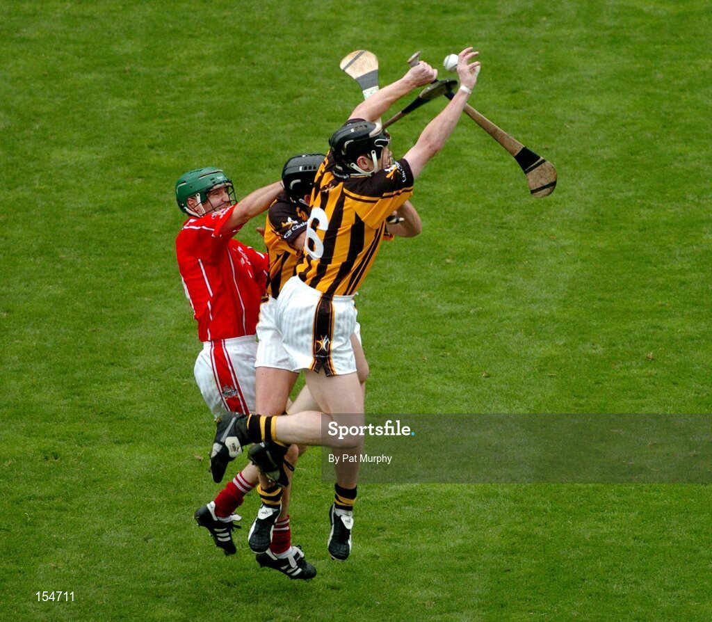 12 September 2004; Jerry O'Connor, Cork, in action against Peter Barry and Derek Lyng, partially hidden, Kilkenny. Guinness All-Ireland Senior Hurling Championship Final, Cork v Kilkenny, Croke Park, Dublin. Picture credit; Pat Murphy / SPORTSFILE *** Local Caption *** Any photograph taken by SPORTSFILE during, or in connection with, the 2004 Guinness All-Ireland Hurling Final which displays GAA logos or contains an image or part of an image of any GAA intellectual property, or, which contains images of a GAA player/players in their playing uniforms, may only be used for editorial and non-advertising purposes.  Use of photographs for advertising, as posters or for purchase separately is strictly prohibited unless prior written approval has been obtained from the Gaelic Athletic Association.