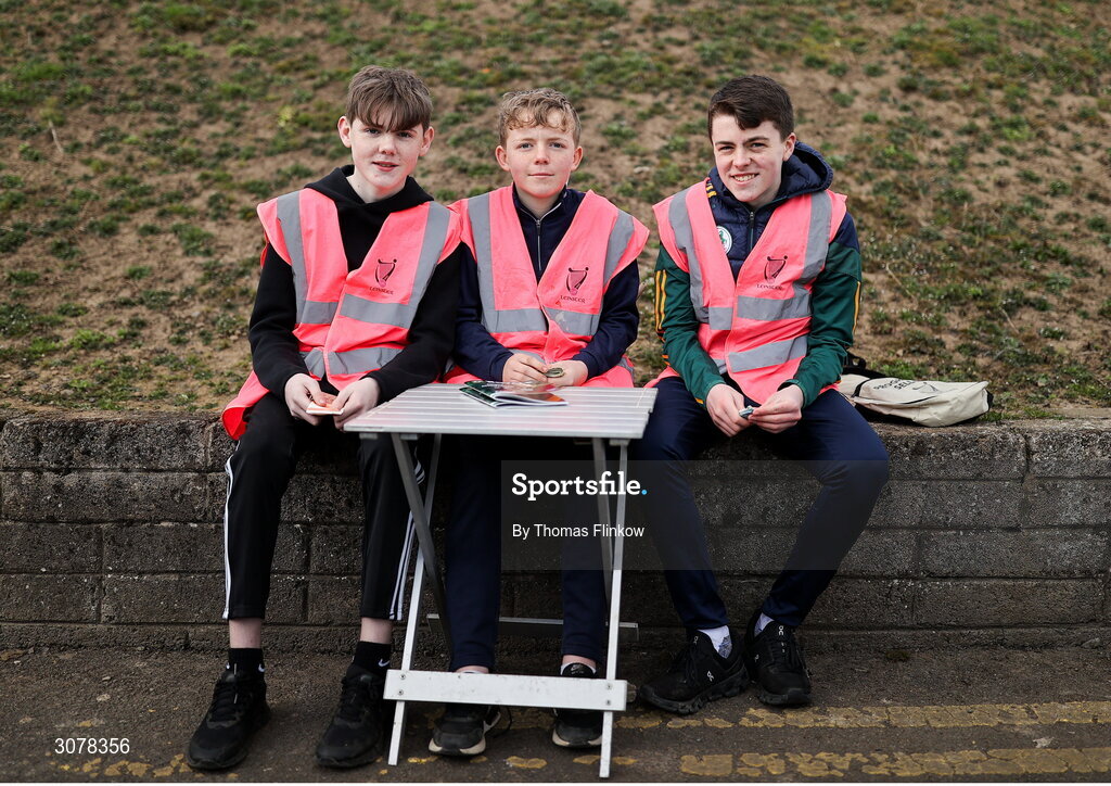 16 March 2025; Match programme sellers, from left, Noah Cassells, Fionn Porter, and Cian Relly before the Allianz Football League Division 2 match between Meath and Monaghan at Páirc Tailteann in Navan, Meath. Photo by Thomas Flinkow/Sportsfile