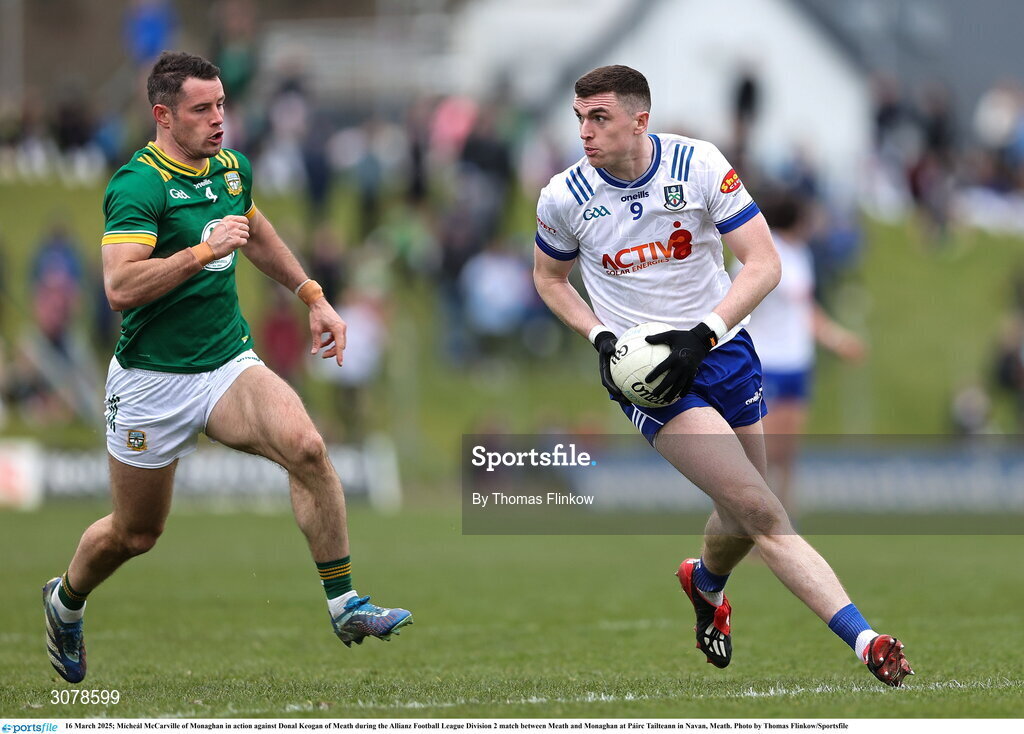 16 March 2025; Mícheál McCarville of Monaghan in action against Donal Keogan of Meath during the Allianz Football League Division 2 match between Meath and Monaghan at Páirc Tailteann in Navan, Meath. Photo by Thomas Flinkow/Sportsfile