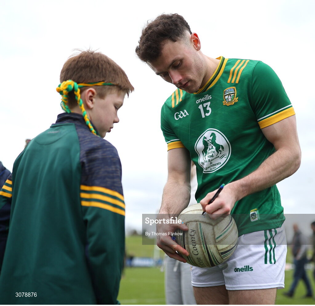 16 March 2025; Jordan Morris of Meath signs the football of supporter Michael O'Reilly, age 8, after the Allianz Football League Division 2 match between Meath and Monaghan at Páirc Tailteann in Navan, Meath. Photo by Thomas Flinkow/Sportsfile