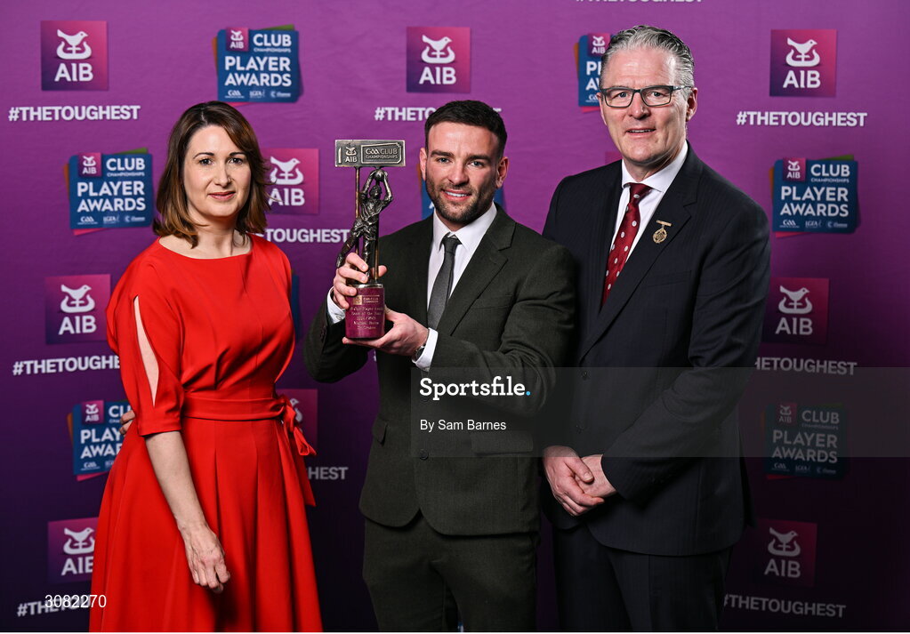 21 March 2025; Dr Crokes footballer Micheál Burns is presented with his 2024/25 Football Team of the Year award by Uachtarán Cumann Lúthchleas Gael, Jarlath Burns and Chief Customer Officer of AIB, Orlaith Ryan, during the AIB Club Player Awards at Croke Park in Dublin. The AIB Club Player Awards celebrated the best players from club Football, Hurling, Camogie, and LGFA in a single ceremony for the first time, recognising their outstanding achievements on the field throughout the season. Photo by Sam Barnes/Sportsfile