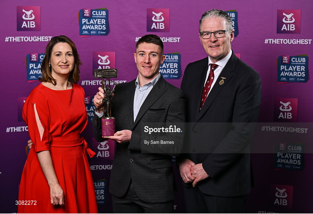 21 March 2025; Na Fianna hurler Andrew Jamieson-Murphy is presented with his 2024/25 Hurling Team of the Year award by Uachtarán Cumann Lúthchleas Gael, Jarlath Burns and Chief Customer Officer of AIB, Orlaith Ryan during the AIB Club Player Awards at Croke Park in Dublin. The AIB Club Player Awards celebrated the best players from club Football, Hurling, Camogie, and LGFA in a single ceremony for the first time, recognising their outstanding achievements on the field throughout the season. Photo by Sam Barnes/Sportsfile