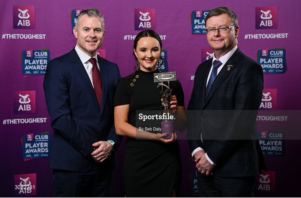 21 March 2025; Loughiel Shamrocks camogie player Amy Boyle is presented her 2024 Camogie Team of the Year award by Uachtarán an Cumann Camógaíochta, Brian Molloy, right, and Chief Marketing Officer of AIB, Mark Doyle during the AIB Club Player Awards at Croke Park in Dublin. The AIB Club Player Awards celebrated the best players from club Football, Hurling, Camogie, and LGFA in a single ceremony for the first time, recognising their outstanding achievements on the field throughout the season. Photo by Seb Daly/Sportsfile