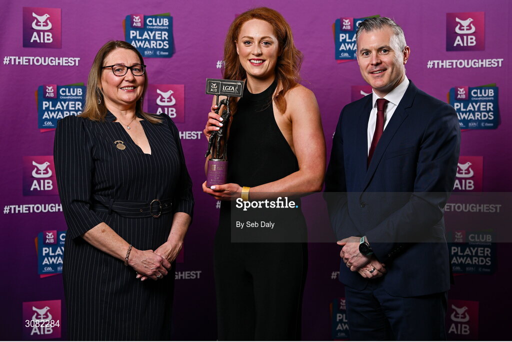 21 March 2025; Kilmacud Crokes ladies footballer Niamh Cotter is presented her 2024 Ladies Gaelic Football Team of the Year award by President of the Ladies Gaelic Football Association, Trina Murray and Chief Marketing Officer of AIB, Mark Doyle during the AIB Club Player Awards at Croke Park in Dublin. The AIB Club Player Awards celebrated the best players from club Football, Hurling, Camogie, and LGFA in a single ceremony for the first time, recognising their outstanding achievements on the field throughout the season. Photo by Seb Daly/Sportsfile