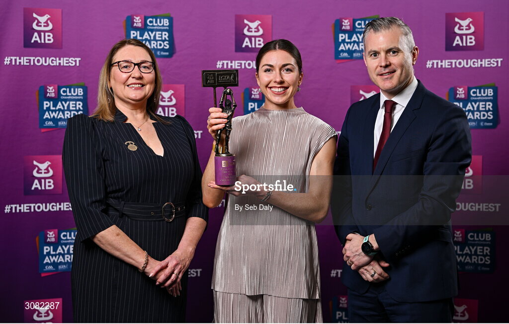 21 March 2025; Castleisland Desmonds ladies footballer Eilís Lynch is presented her 2024 Ladies Gaelic Football Team of the Year award by President of the Ladies Gaelic Football Association, Trina Murray and Chief Marketing Officer of AIB, Mark Doyle during the AIB Club Player Awards at Croke Park in Dublin. The AIB Club Player Awards celebrated the best players from club Football, Hurling, Camogie, and LGFA in a single ceremony for the first time, recognising their outstanding achievements on the field throughout the season. Photo by Seb Daly/Sportsfile