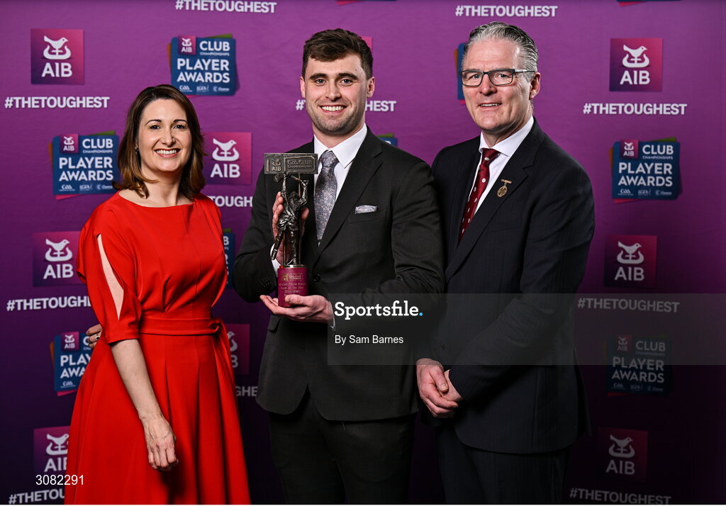 21 March 2025; Na Fianna hurler Brian Ryan is presented with his 2024/25 Hurling Team of the Year award by Uachtarán Cumann Lúthchleas Gael, Jarlath Burns and Chief Customer Officer of AIB, Orlaith Ryan during the AIB Club Player Awards at Croke Park in Dublin. The AIB Club Player Awards celebrated the best players from club Football, Hurling, Camogie, and LGFA in a single ceremony for the first time, recognising their outstanding achievements on the field throughout the season. Photo by Sam Barnes/Sportsfile
