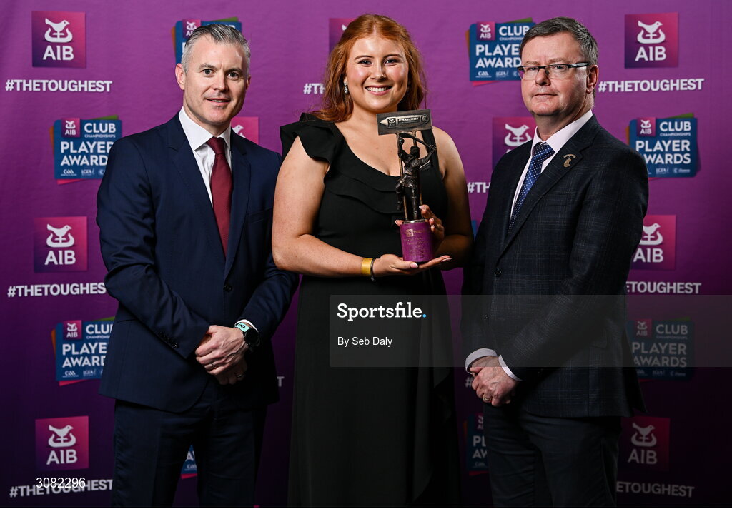 21 March 2025; Truagh Clonlara camogie player Sophie Cullen is presented her 2024 Camogie Team of the Year award by Uachtarán an Cumann Camógaíochta, Brian Molloy, right, and Chief Marketing Officer of AIB, Mark Doyle during the AIB Club Player Awards at Croke Park in Dublin. The AIB Club Player Awards celebrated the best players from club Football, Hurling, Camogie, and LGFA in a single ceremony for the first time, recognising their outstanding achievements on the field throughout the season. Photo by Seb Daly/Sportsfile