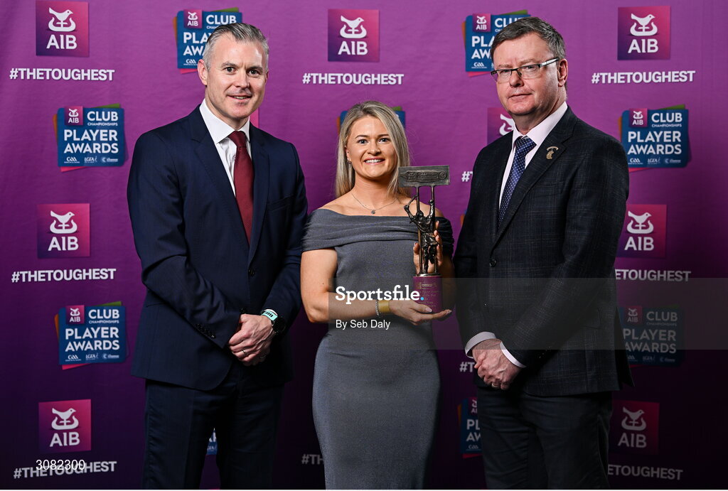 21 March 2025; Truagh Clonlara camogie player Sinead Hogg is presented her 2024 Camogie Team of the Year award by Uachtarán an Cumann Camógaíochta, Brian Molloy, right, and Chief Marketing Officer of AIB, Mark Doyle during the AIB Club Player Awards at Croke Park in Dublin. The AIB Club Player Awards celebrated the best players from club Football, Hurling, Camogie, and LGFA in a single ceremony for the first time, recognising their outstanding achievements on the field throughout the season. Photo by Seb Daly/Sportsfile