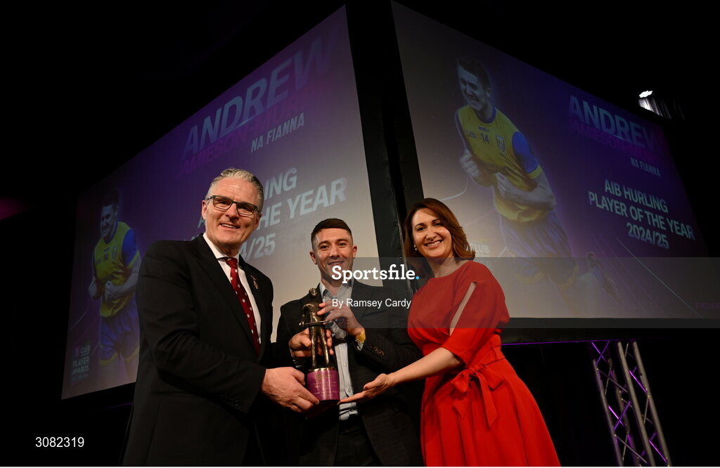 21 March 2025; Andrew Jamieson-Murphy of Na Fianna is presented with his 2024/25 AIB GAA Hurling Club Championship Player of the Year award by Uachtarán Cumann Lúthchleas Gael Jarlath Burns and AIB Chief Customer Officer Orlaith Ryan during the AIB Club Player Awards at Croke Park in Dublin. The AIB Club Player Awards celebrated the best players from club Football, Hurling, Camogie, and LGFA in a single ceremony for the first time, recognising their outstanding achievements on the field throughout the season. Photo by Ramsey Cardy/Sportsfile
