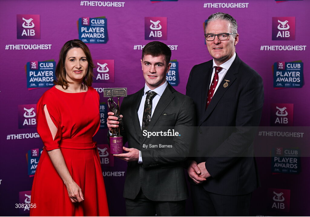 21 March 2025; Errigal Ciaran footballer Ruairí Canavan is presented with his 2024/25 Football Team of the Year award by Uachtarán Cumann Lúthchleas Gael, Jarlath Burns and Chief Customer Officer of AIB, Orlaith Ryan, during the AIB Club Player Awards at Croke Park in Dublin. The AIB Club Player Awards celebrated the best players from club Football, Hurling, Camogie, and LGFA in a single ceremony for the first time, recognising their outstanding achievements on the field throughout the season. Photo by Sam Barnes/Sportsfile