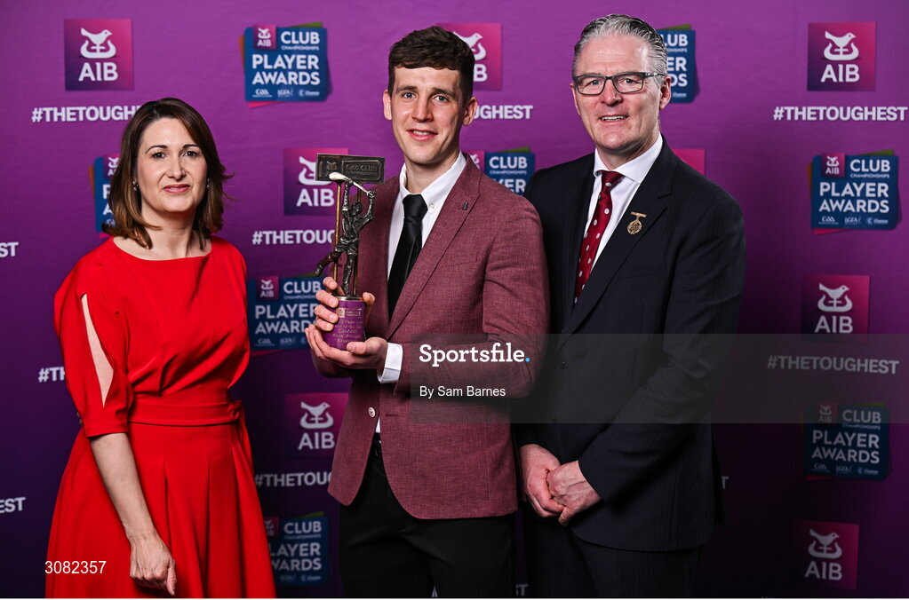 21 March 2025; Slaughtneil hurler Shane McGuigan is presented with his 2024/25 Hurling Team of the Year award by Uachtarán Cumann Lúthchleas Gael, Jarlath Burns and Chief Customer Officer of AIB, Orlaith Ryan during the AIB Club Player Awards at Croke Park in Dublin. The AIB Club Player Awards celebrated the best players from club Football, Hurling, Camogie, and LGFA in a single ceremony for the first time, recognising their outstanding achievements on the field throughout the season. Photo by Sam Barnes/Sportsfile
