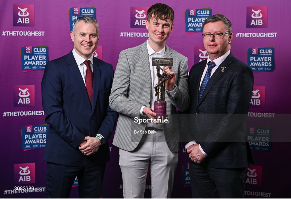 21 March 2025; Kilkerrin-Clonberne ladies footballer Louise Ward's brother Alan is presented with her 2024 Camogie Team of the Year award by Uachtarán an Cumann Camógaíochta, Brian Molloy, right, and Chief Marketing Officer of AIB, Mark Doyle during the AIB Club Player Awards at Croke Park in Dublin. The AIB Club Player Awards celebrated the best players from club Football, Hurling, Camogie, and LGFA in a single ceremony for the first time, recognising their outstanding achievements on the field throughout the season. Photo by Seb Daly/Sportsfile