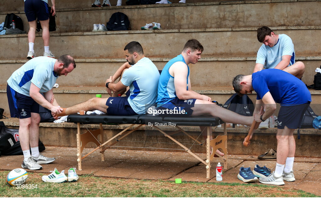 24 March 2025; Lead academy physiotherapist Darren Hickey, left, straps up Max Deegan as physiotherapist Rob Buckley straps up Diarmuid Mangan before a Leinster Rugby squad training session at Northwood College in Durban, South Africa. Photo by Shaun Roy/Sportsfile