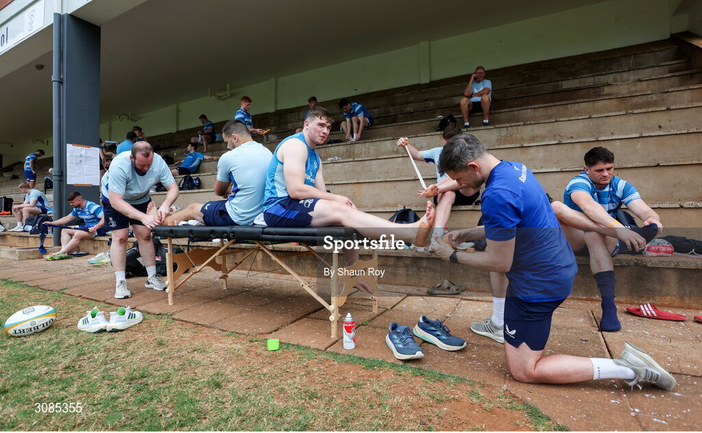24 March 2025; Lead academy physiotherapist Darren Hickey, left, straps up Max Deegan as physiotherapist Rob Buckley straps up Diarmuid Mangan before a Leinster Rugby squad training session at Northwood College in Durban, South Africa. Photo by Shaun Roy/Sportsfile