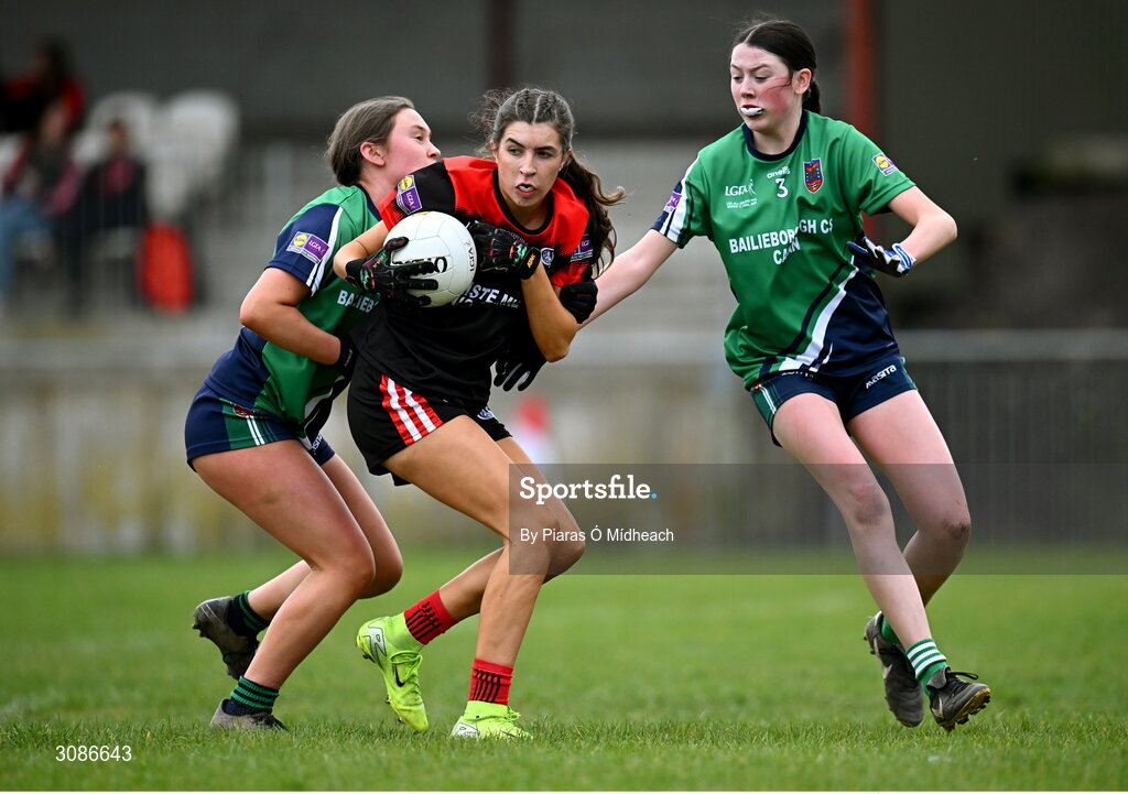 26 March 2025; Sadbh Griffin of Coláiste Muire Ennis in action against Caoimhe Clarke, left, and Aoife Rogers of Bailieborough Community School during the Lidl LGFA PPS All-Ireland Senior C final match between Bailieborough Community School of Cavan and Coláiste Muire of Clare at Geraldine Park in Athy, Kildare. Photo by Piaras Ó Mídheach/Sportsfile