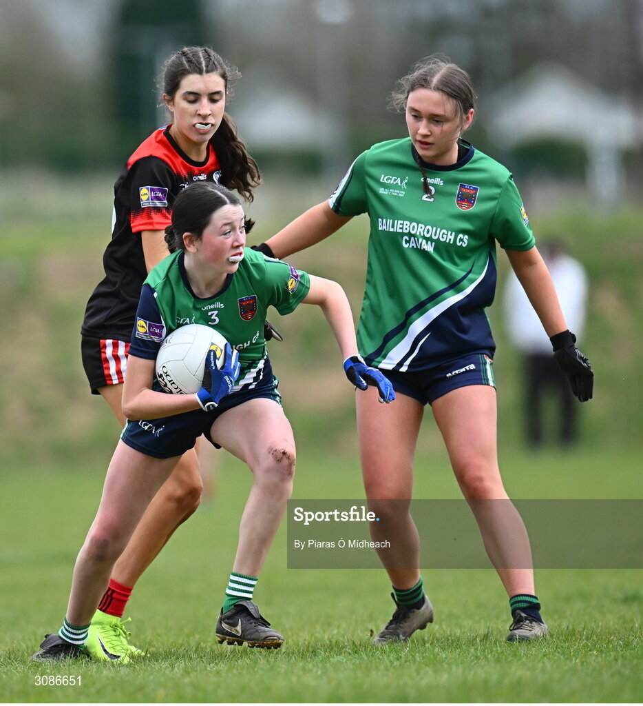 26 March 2025; Aoife Rogers of Bailieborough Community School, supported by team-mate Caoimhe Clarke, 2, in action against Sadbh Griffin of Coláiste Muire Ennis during the Lidl LGFA PPS All-Ireland Senior C final match between Bailieborough Community School of Cavan and Coláiste Muire of Clare at Geraldine Park in Athy, Kildare. Photo by Piaras Ó Mídheach/Sportsfile