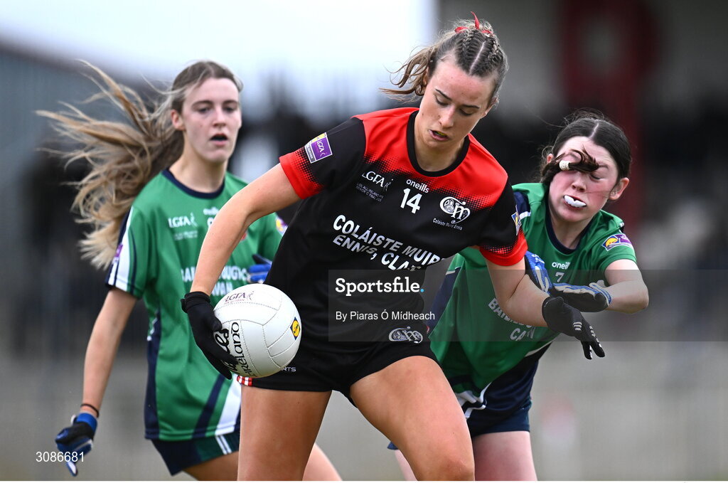 26 March 2025; Eabha O'Driscoll of Coláiste Muire Ennis in action against Gia McCabe, left, and Aoife Rogers of Bailieborough Community School during the Lidl LGFA PPS All-Ireland Senior C final match between Bailieborough Community School of Cavan and Coláiste Muire of Clare at Geraldine Park in Athy, Kildare. Photo by Piaras Ó Mídheach/Sportsfile