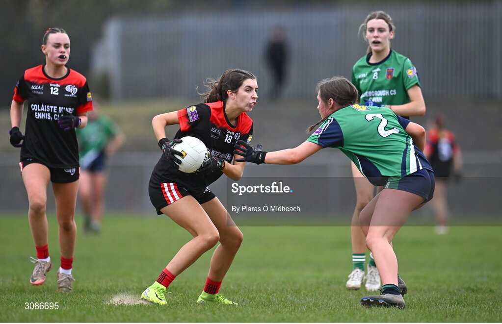 26 March 2025; Sadbh Griffin of Coláiste Muire Ennis in action against Caoimhe Clarke of Bailieborough Community School during the Lidl LGFA PPS All-Ireland Senior C final match between Bailieborough Community School of Cavan and Coláiste Muire of Clare at Geraldine Park in Athy, Kildare. Photo by Piaras Ó Mídheach/Sportsfile