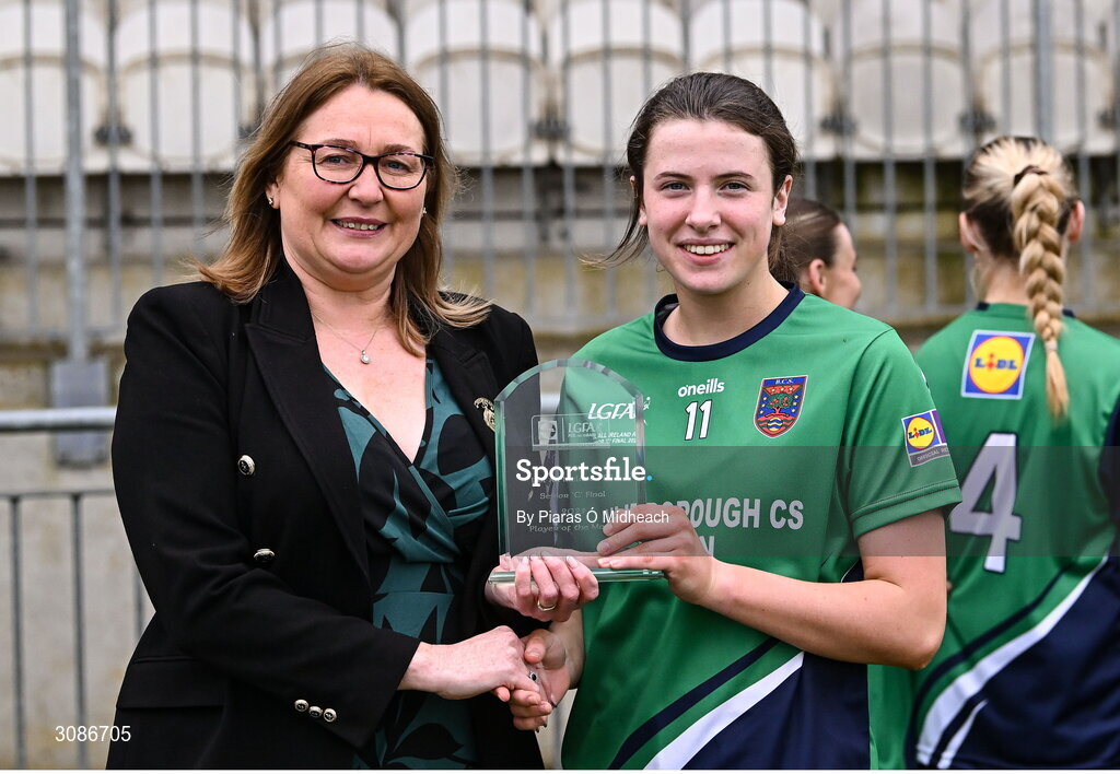 26 March 2025; Abby Reilly of Bailieborough Community School receives the Player of the Match award from LGFA President Trina Murray after her side's victory in the Lidl LGFA PPS All-Ireland Senior C final match between Bailieborough Community School of Cavan and Coláiste Muire of Clare at Geraldine Park in Athy, Kildare. Photo by Piaras Ó Mídheach/Sportsfile