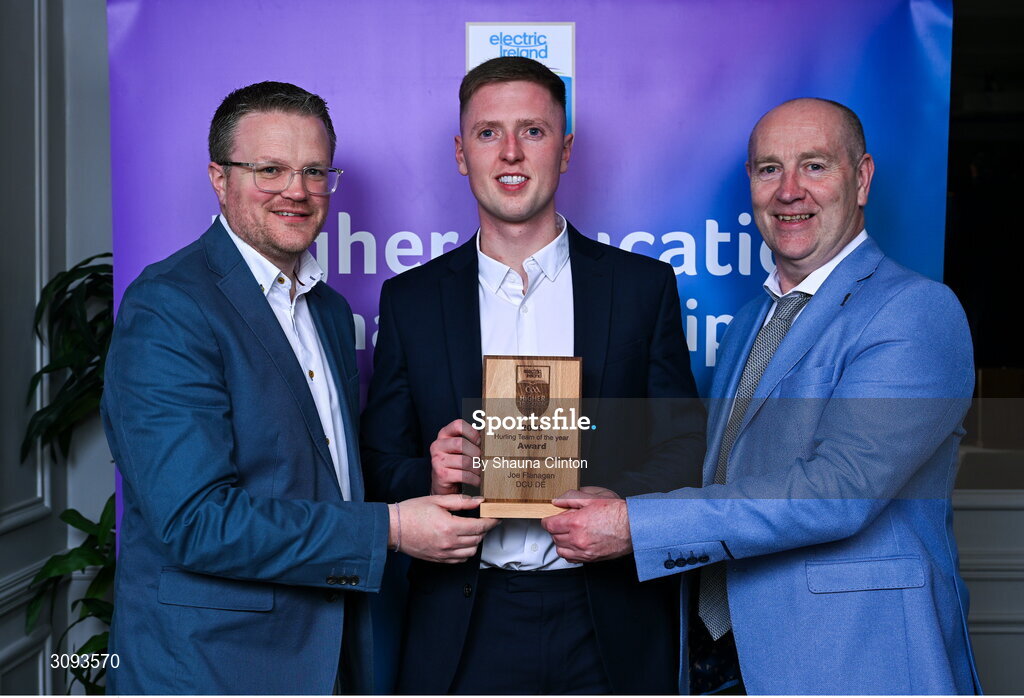 31 March 2025; DCU Dóchas Éireann player Joe Flanagan, centre, is presented with his 2025 Electric Ireland Higher Education GAA Hurling Rising Stars Team of the Year award by Electric Ireland Group Sponsorship & PR Manager Rob Crabbe, left, and Higher Education GAA Chairperson Benny Hurl during the Electric Ireland Higher Education Rising Stars Awards at Castleknock Hotel in Dublin. Photo by Shauna Clinton/Sportsfile