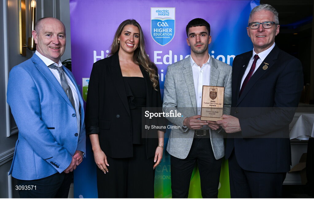 31 March 2025; DCU Dóchas Éireann player Ciarán Caulfield, centre, is presented with the Electric Ireland Higher Education GAA Football Rising Stars Player of the Year award by, from left, Higher Education GAA Chairperson Benny Hurl, Electric Ireland Sponsorship Manager Sarah Gelletlie and Uachtarán Chumann Lúthchleas Gael Jarlath Burns during the Electric Ireland Higher Education Rising Stars Awards at Castleknock Hotel in Dublin. Photo by Shauna Clinton/Sportsfile