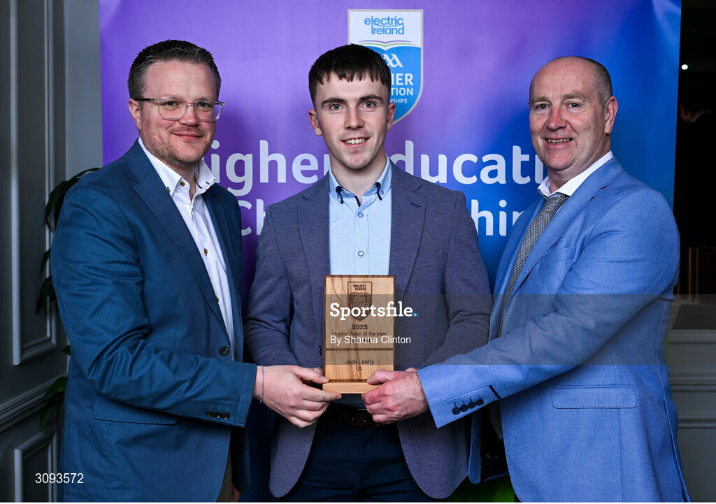 31 March 2025; University of Limerick player Jack Leahy, centre, is presented with his 2025 Electric Ireland Higher Education GAA Hurling Rising Stars Team of the Year award by Electric Ireland Group Sponsorship & PR Manager Rob Crabbe, left, and Higher Education GAA Chairperson Benny Hurl during the Electric Ireland Higher Education Rising Stars Awards at Castleknock Hotel in Dublin. Photo by Shauna Clinton/Sportsfile