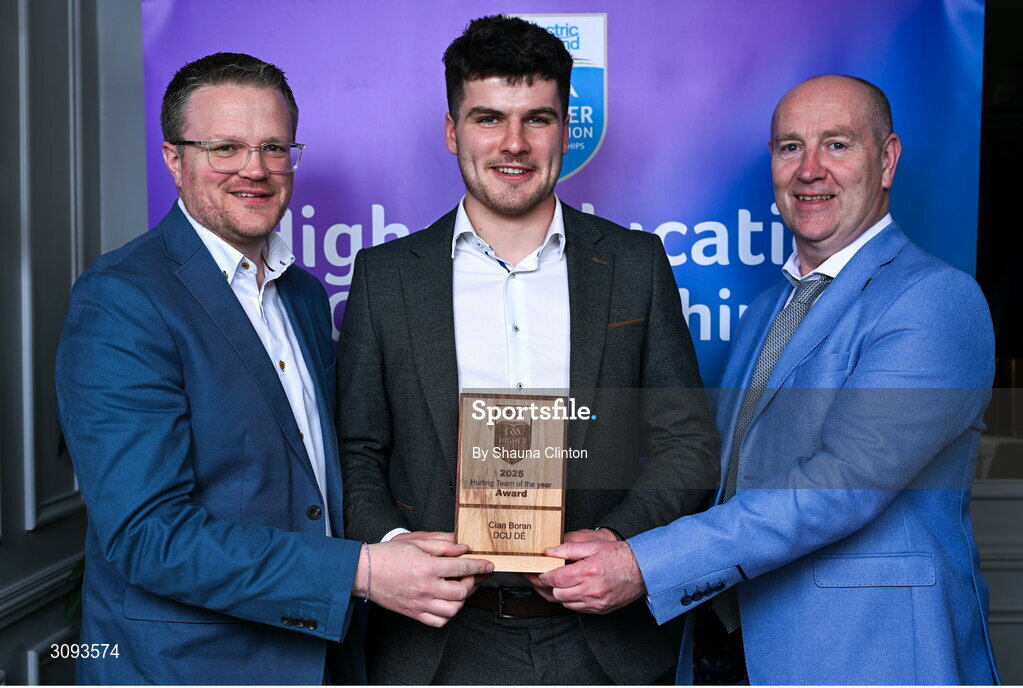 31 March 2025; DCU Dóchas Éireann player Cian Boran, centre, is presented with his 2025 Electric Ireland Higher Education GAA Hurling Rising Stars Team of the Year award by Electric Ireland Group Sponsorship & PR Manager Rob Crabbe, left, and Higher Education GAA Chairperson Benny Hurl during the Electric Ireland Higher Education Rising Stars Awards at Castleknock Hotel in Dublin. Photo by Shauna Clinton/Sportsfile