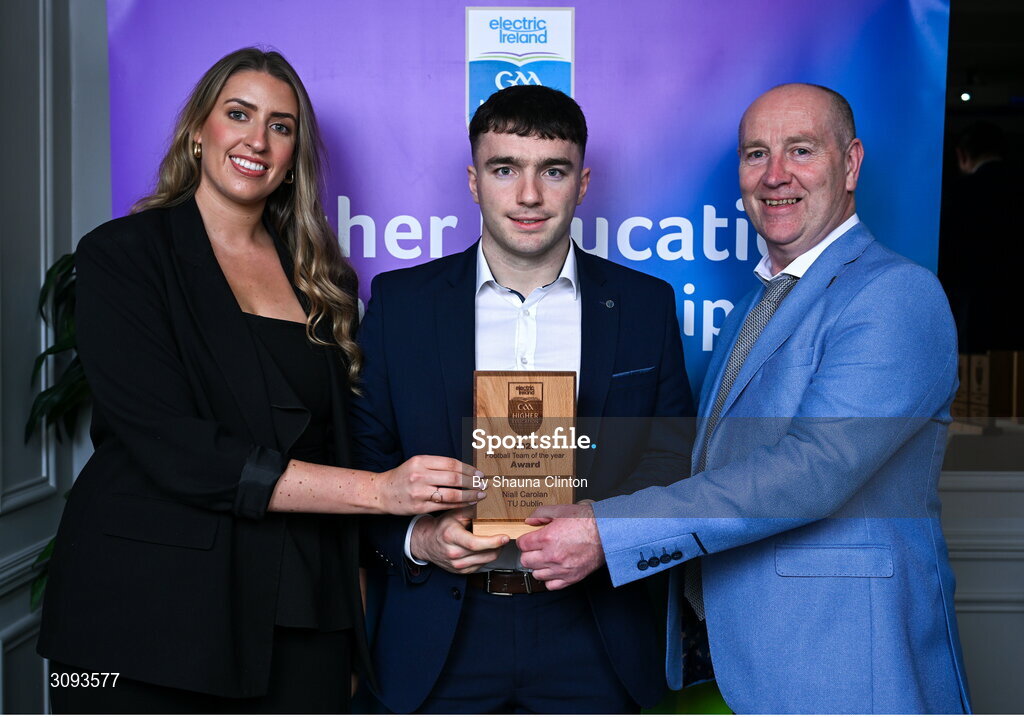 31 March 2025; Technological University Dublin player Niall Carolan, centre, is presented with his 2025 Electric Ireland Higher Education GAA Football Rising Stars Team of the Year award by Electric Ireland Sponsorship Manager Sarah Gelletlie, left, and Higher Education GAA Chairperson Benny Hurl during the Electric Ireland Higher Education Rising Stars Awards at Castleknock Hotel in Dublin. Photo by Shauna Clinton/Sportsfile