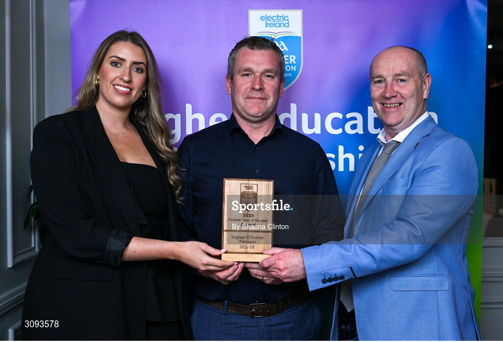 31 March 2025; Skerries Harps Chairman Martin Kenny, centre, accepts the 2025 Electric Ireland Higher Education GAA Football Rising Stars Team of the Year award on behalf of DCU Dóchas Éireann player Eoghan O’Connor Flanagan, not pictured, from Electric Ireland Sponsorship Manager Sarah Gelletlie, left, and Higher Education GAA Chairperson Benny Hurl during the Electric Ireland Higher Education Rising Stars Awards at Castleknock Hotel in Dublin. Photo by Shauna Clinton/Sportsfile