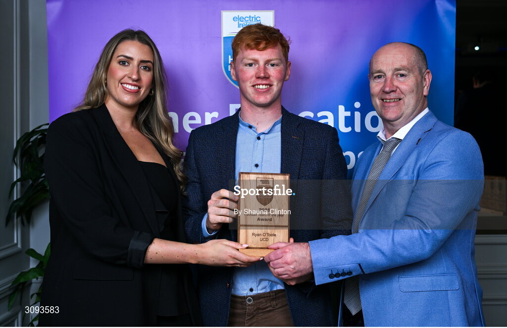 31 March 2025; University College Dublin player Ryan O’Toole, centre, is presented with his 2025 Electric Ireland Higher Education GAA Football Rising Stars Team of the Year award by Electric Ireland Sponsorship Manager Sarah Gelletlie, left, and Higher Education GAA Chairperson Benny Hurl during the Electric Ireland Higher Education Rising Stars Awards at Castleknock Hotel in Dublin. Photo by Shauna Clinton/Sportsfile