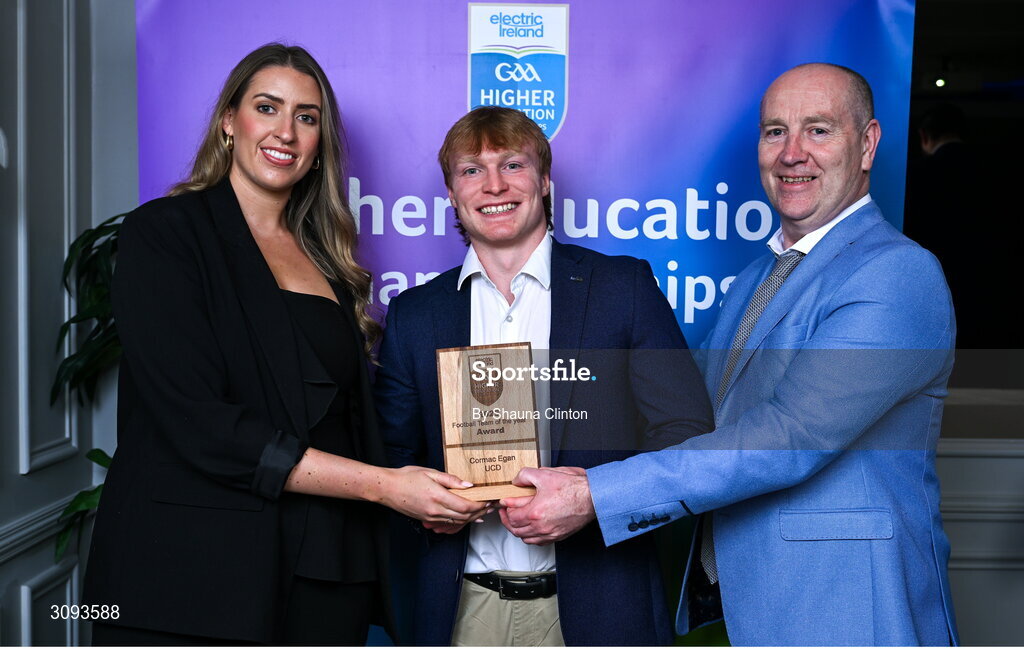 31 March 2025; University College Dublin player Cormac Egan, centre, is presented with his 2025 Electric Ireland Higher Education GAA Football Rising Stars Team of the Year award by Electric Ireland Sponsorship Manager Sarah Gelletlie, left, and Higher Education GAA Chairperson Benny Hurl during the Electric Ireland Higher Education Rising Stars Awards at Castleknock Hotel in Dublin. Photo by Shauna Clinton/Sportsfile