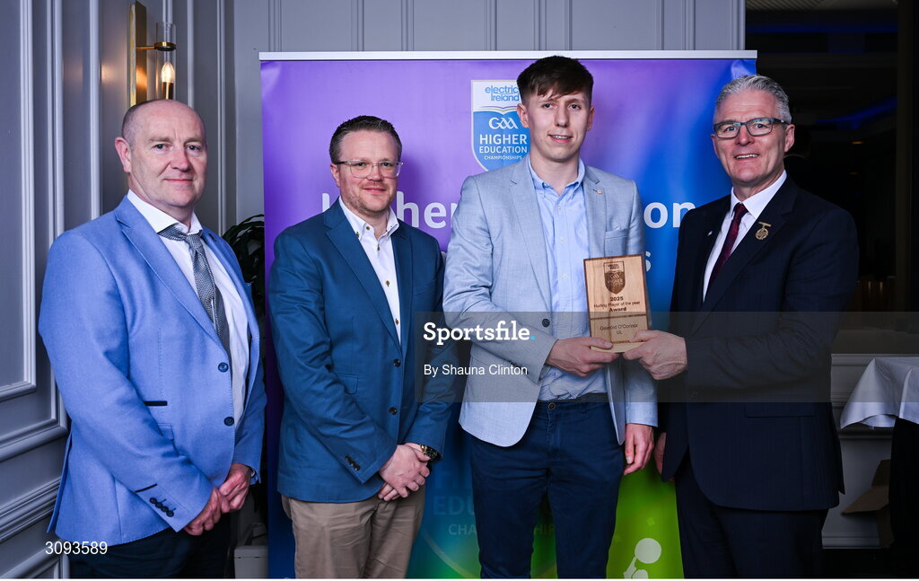31 March 2025; University of Limerick player Gearoid O'Connor, centre, is presented with the 2025 Electric Ireland Higher Education GAA Hurling Rising Stars Player of the Year award by, from left, Higher Education GAA Chairperson Benny Hurl, Electric Ireland Group Sponsorship & PR Manager Rob Crabbe and Uachtarán Chumann Lúthchleas Gael Jarlath Burns during the Electric Ireland Higher Education Rising Stars Awards at Castleknock Hotel in Dublin. Photo by Shauna Clinton/Sportsfile