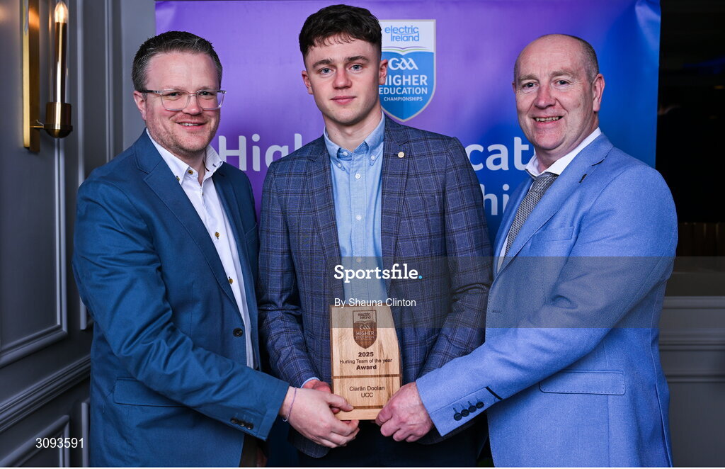 31 March 2025; University College Cork player Ciaran Doolin, centre, is presented with his 2025 Electric Ireland Higher Education GAA Hurling Rising Stars Team of the Year award by Electric Ireland Group Sponsorship & PR Manager Rob Crabbe, left, and Higher Education GAA Chairperson Benny Hurl during the Electric Ireland Higher Education Rising Stars Awards at Castleknock Hotel in Dublin. Photo by Shauna Clinton/Sportsfile